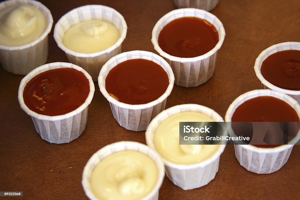 Sauce Mania: Fast food Cups of mayonnaise and ketchup  Color Image Stock Photo