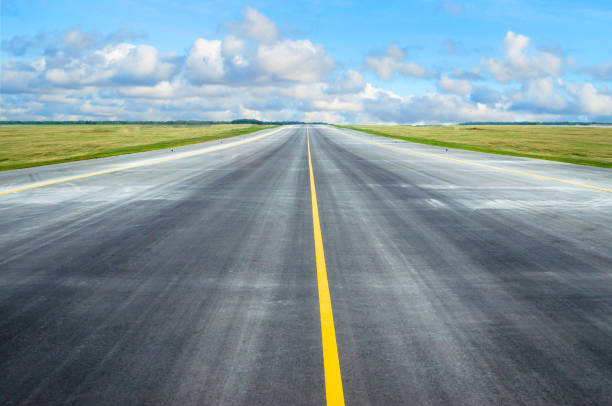 istock Asphalt road runway with a dividing strip in the horizon. 893228236