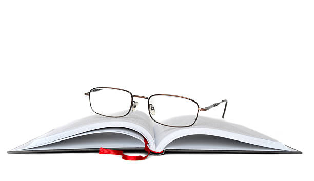 Eyeglasses with book stock photo