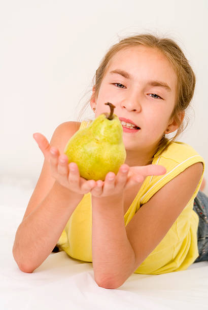 istock Girl with a pear I 89324161