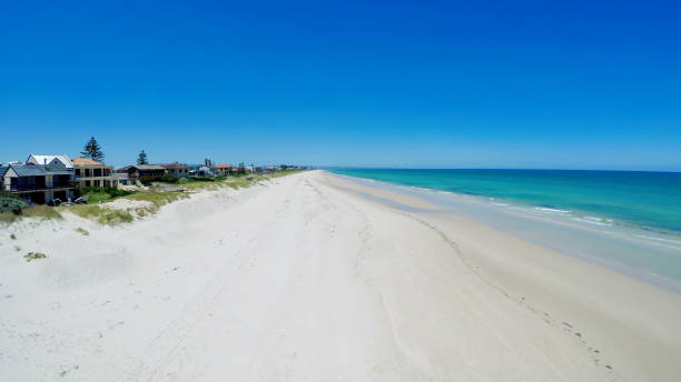 istock Drone aerial view of wide open white sandy beach 893246604