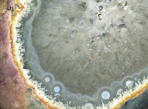 abstract full frame closeup of a lateral cutted and polished gem surface with phantastic structures