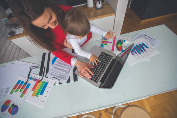 istock Working mother and baby daughter 893252290