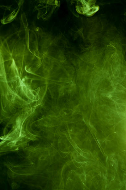 istock Green smoke on a black background. smoke on a black background. 893256806