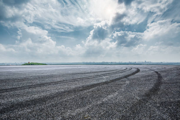 istock International circuit asphalt road and blue sky landscape 893256864