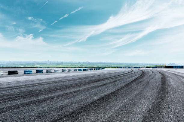 istock International circuit asphalt road and blue sky landscape 893257180