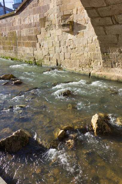 istock boulevard on a riverside with bridge and concrete elements in december christmas advent 893259376