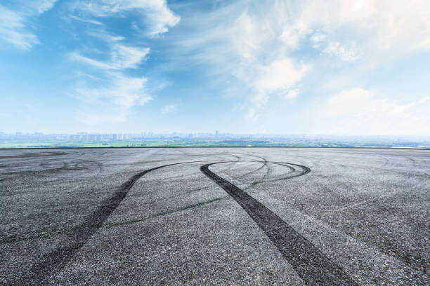 istock International circuit asphalt road and blue sky landscape 893259570