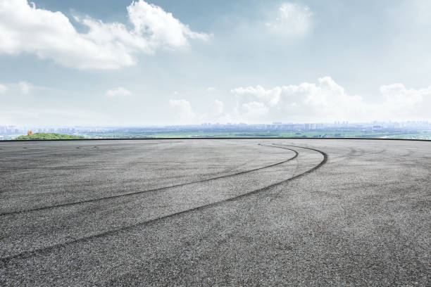 istock International circuit asphalt road and blue sky landscape 893259766