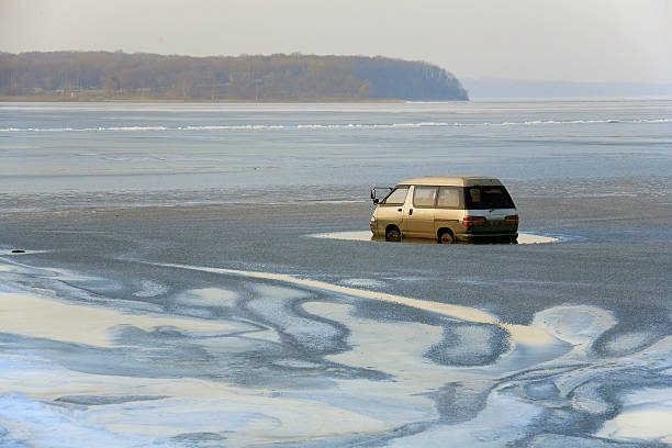 boat caught in ice. speedboat on frozen lake or sea. ocean at winter time
