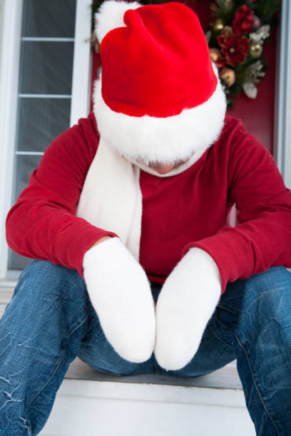 Male sitting on Christmas Porch