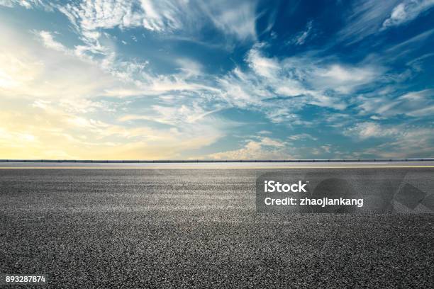 Empty Highway Asphalt Road And Beautiful Sky Sunset Landscape Stock Photo - Download Image Now