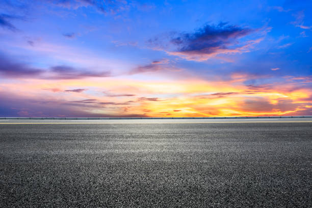 istock Empty highway asphalt road and beautiful sky sunset landscape 893294378