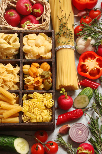 istock Pasta brown square wooden box on white background 893297000