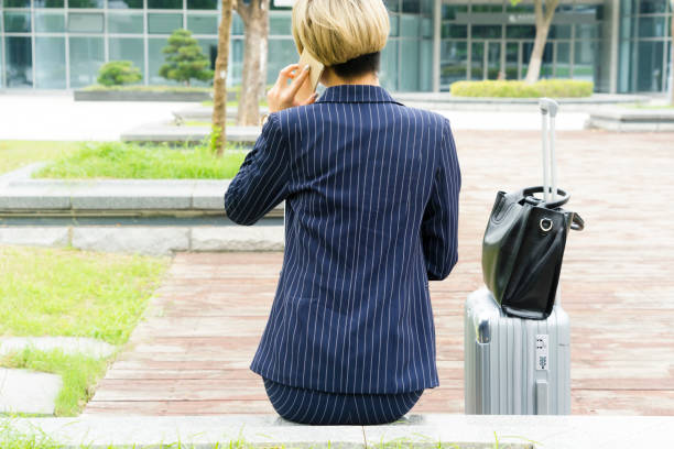 istock businesswoman multitasking outdoors 893301826