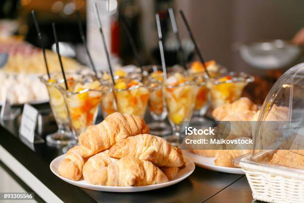 Fresh Pastry Crispy Morning Croissants Hotel Breakfast Buffet Dessert Fruit Cocktail In Cups Stock Photo - Download Image Now