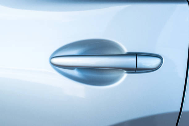 istock Car door handle silver color for customers. 893307808