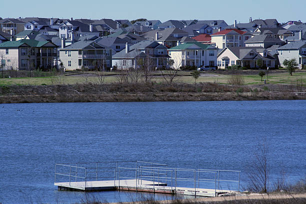 istock Homes by a lake with fishing pier 89331043