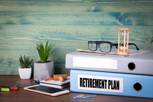 istock retirement plan concept. Binders on desk in the office. Business background 893311464
