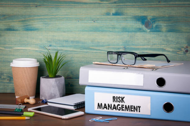 istock risk management concept. Binders on desk in the office. Business background 893312536