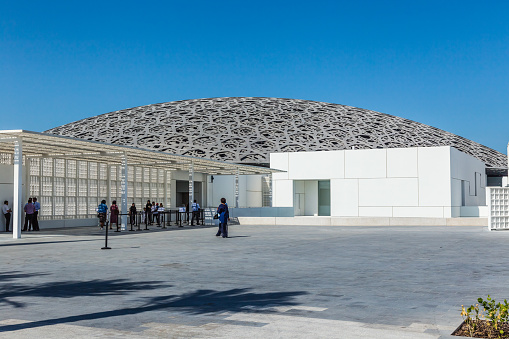 Visitors approaching the entrance to the Louvre, Abu Dhabi, United Arab Emirates. The museum first opened on November 11, 2017. This image was taken on November 14, 2017.