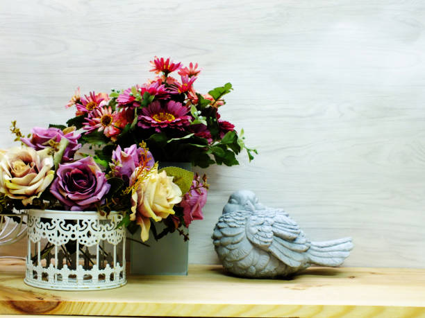 istock home decoration with candle lanterns and flowers bouquet 893321176