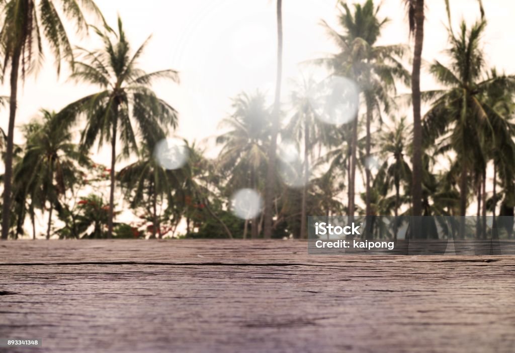 Empty wood table with coconuts tree tropical scenery view Beach Stock Photo