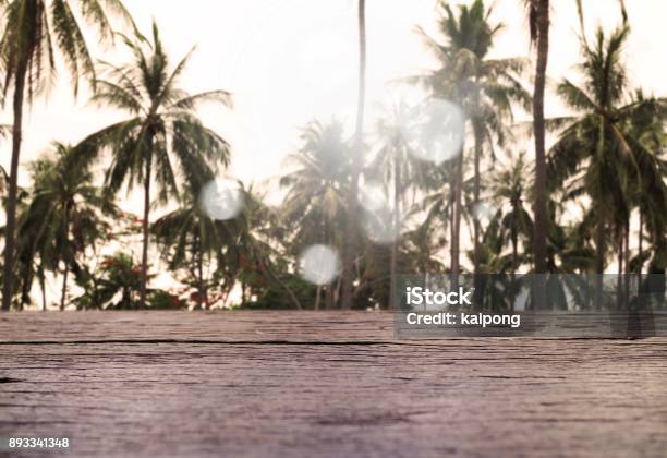 Empty Wood Table With Coconuts Tree Tropical Scenery View Stock Photo - Download Image Now