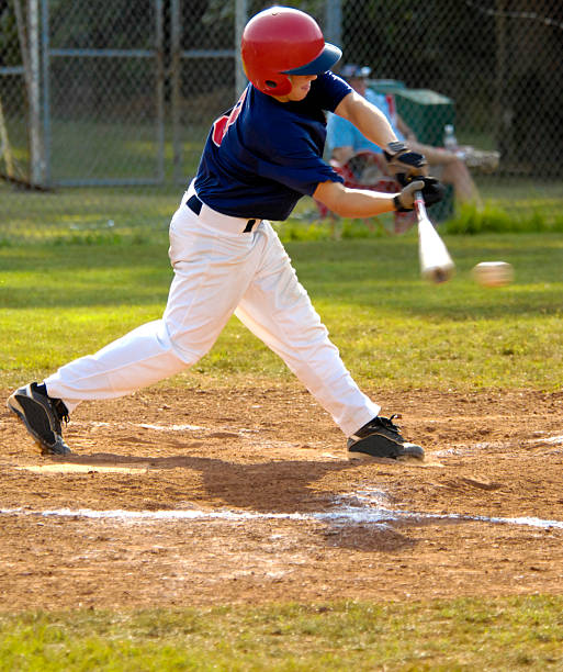 istock Baseball player swinging baseball bat at baseball at baseball game 89334256