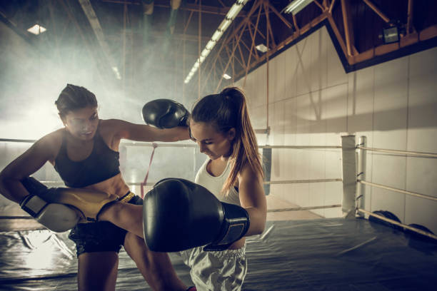 istock Self-defense on kickboxing match in a ring! 893350202