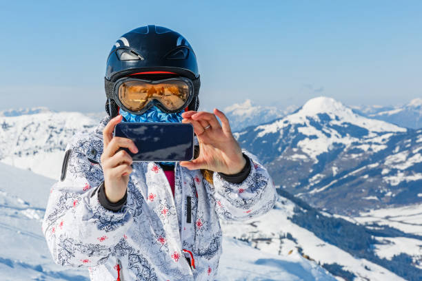 istock Skier taking photos with the smartphone 893354744