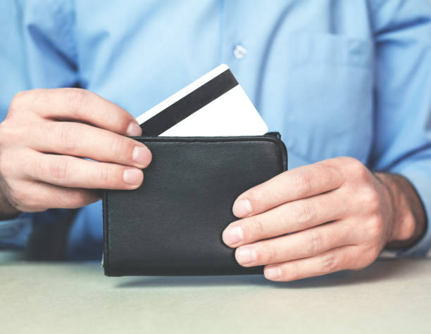 istock Man showing credit card. 893369624