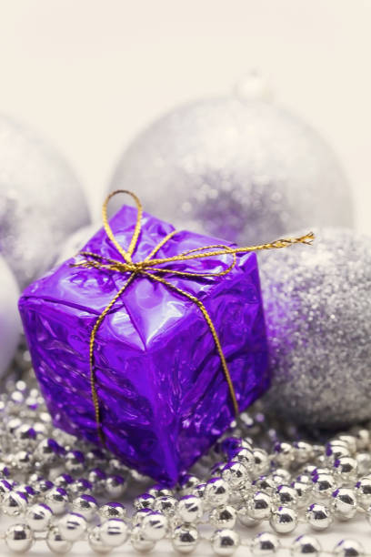 istock Silver Christmas decoration, balls, beads, bell close up isolated 893369706