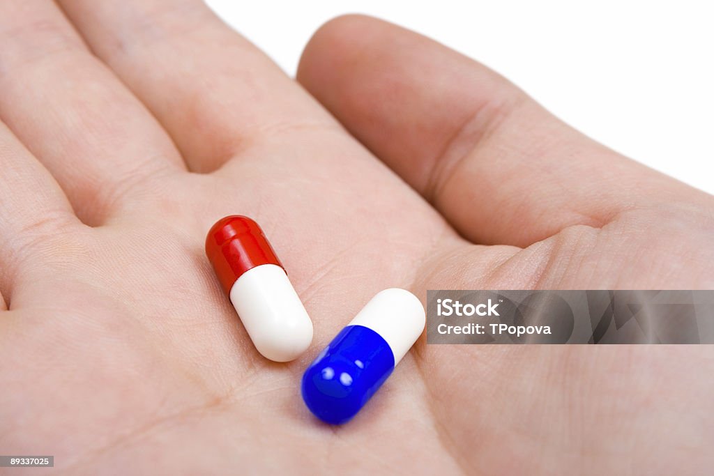 Hand and pills  A Helping Hand Stock Photo