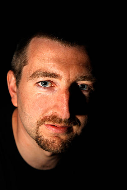 istock Atmospheric/Moody Man's Face. Gritty black/white version of same below 89337704