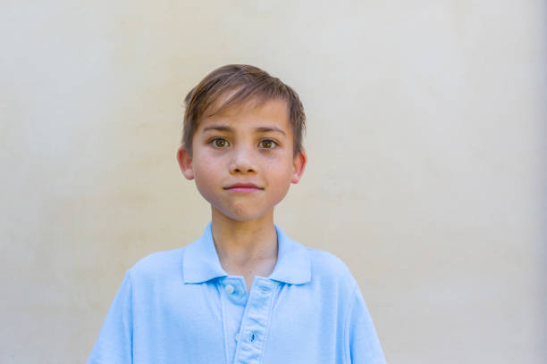 Young boy in his school uniform shirt
