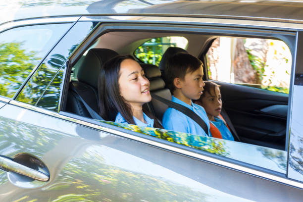 istock Children in the Car Going to School 893388190