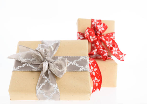 istock Christmas brown gift boxes wrapped with red and silver ribbon isolated on white background 893395074