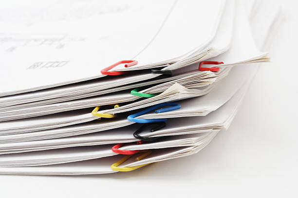 istock Sheets of paper pile fastened by paperclips 89339542