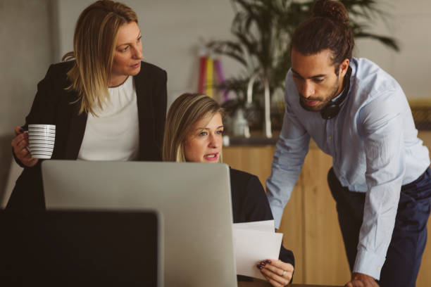 istock Businesspeople Working Together In The Modern Office 893395710
