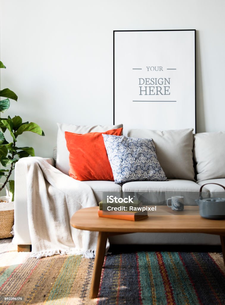 Living room with wall frame mockup Pillow Stock Photo