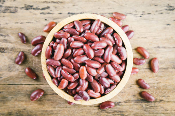 istock Red bean kidney in a bowl on wooden background. 893400132