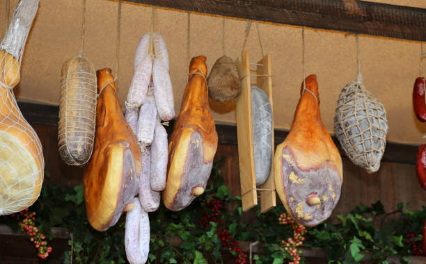 istock cold cuts and hams hanging in the delicacy store 893407362