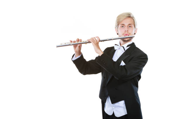 istock Male flutist wearing tailcoat plays flute 893407382