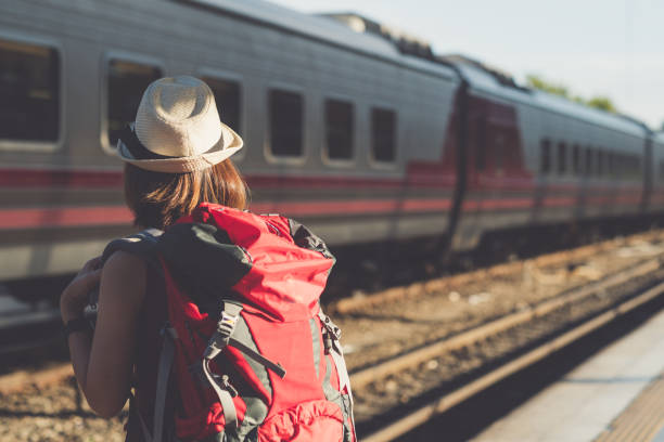 istock A traveler with backpack waiting for a train in railway station platform 893417362