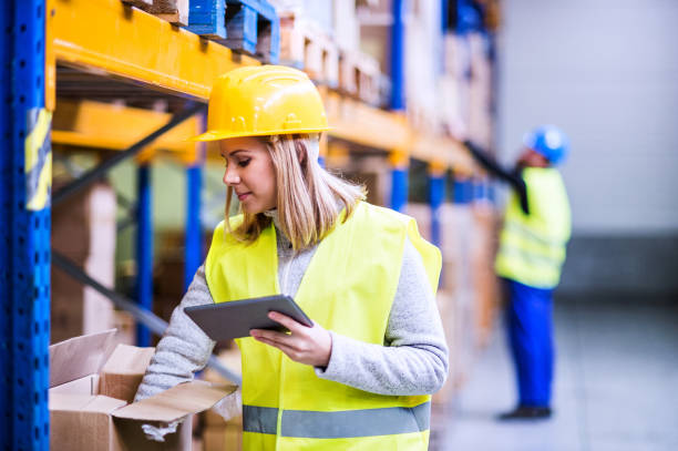 istock Woman warehouse worker with tablet. 893419802