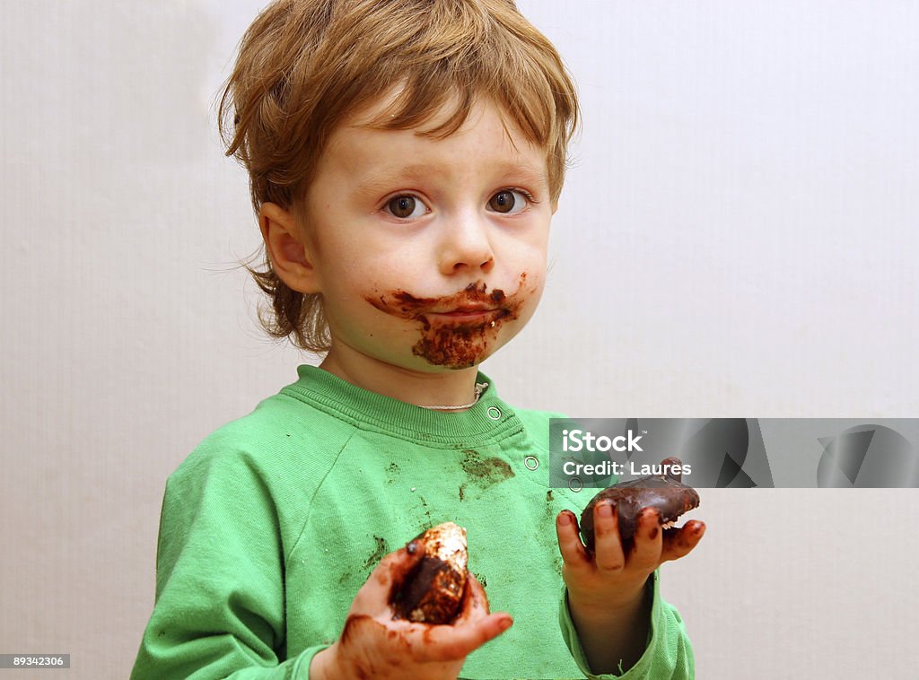 The boy eats a zephyr  Chocolate Stock Photo