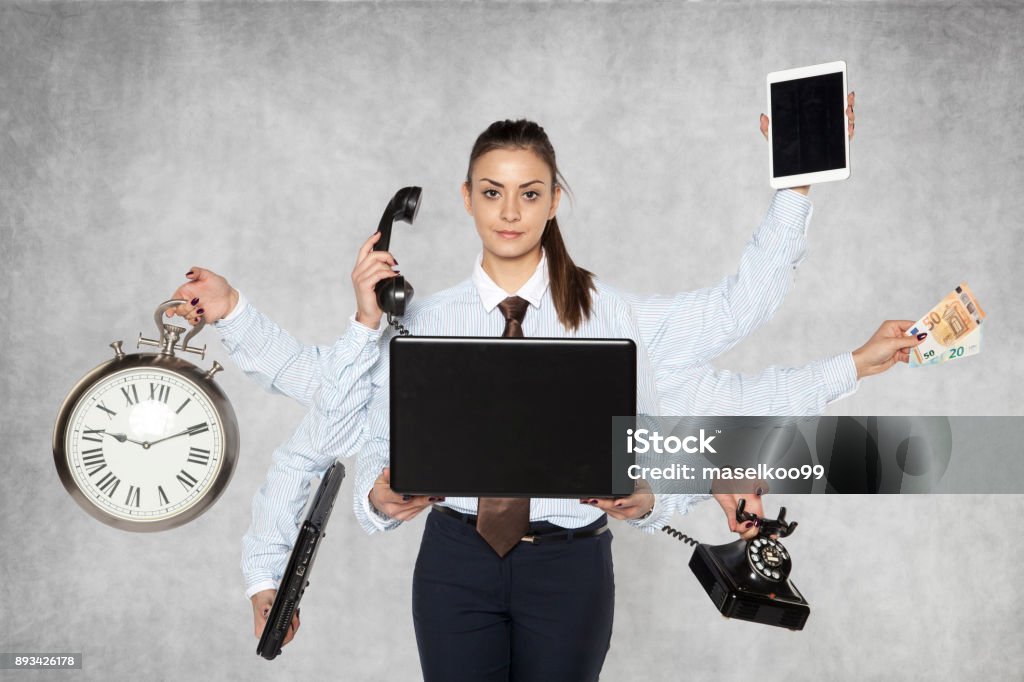 modern businesswoman replaces several people at once Multi-Tasking Stock Photo