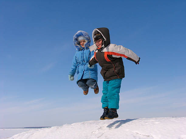 istock Jumping boy and girl 89342902