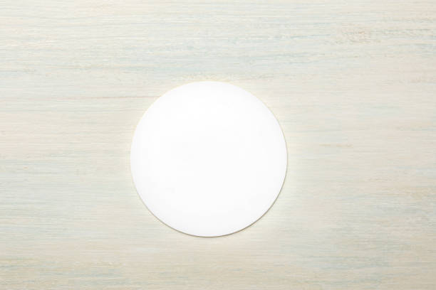 istock Mockup of round white business card on light background 893433678